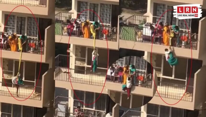 फरीदाबाद की ग्रैंडुरा सोसाइटी में चौथी मंजिल से लटकते बच्चे का वायरल वीडियो दृश्य
