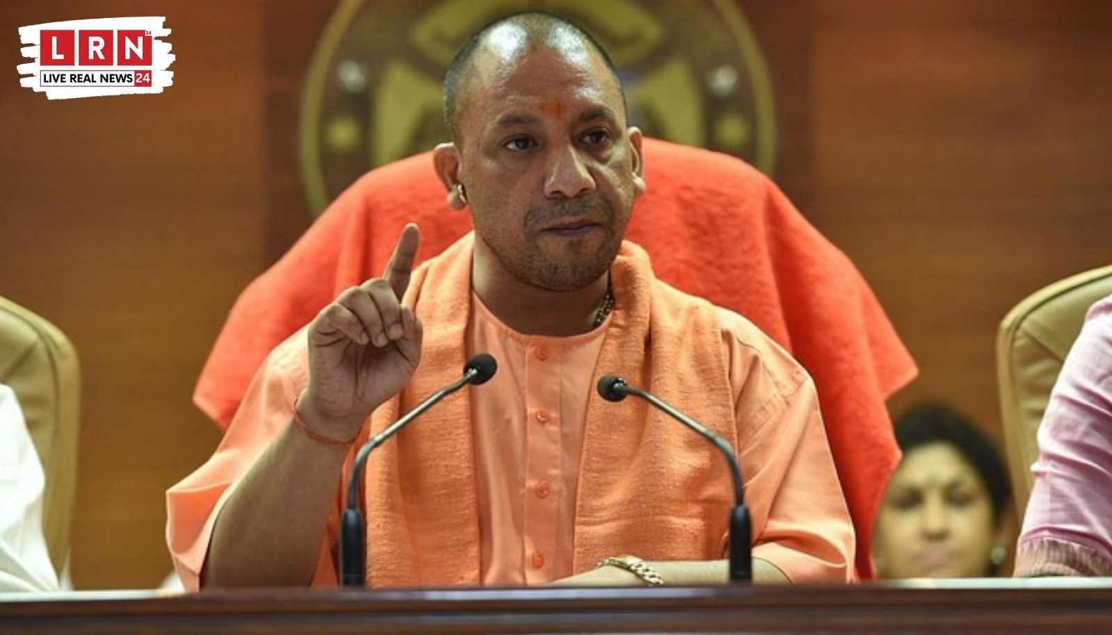 CM Yogi Adityanath giving benefits to Anganwadi workers on International Women Day in Uttar Pradesh